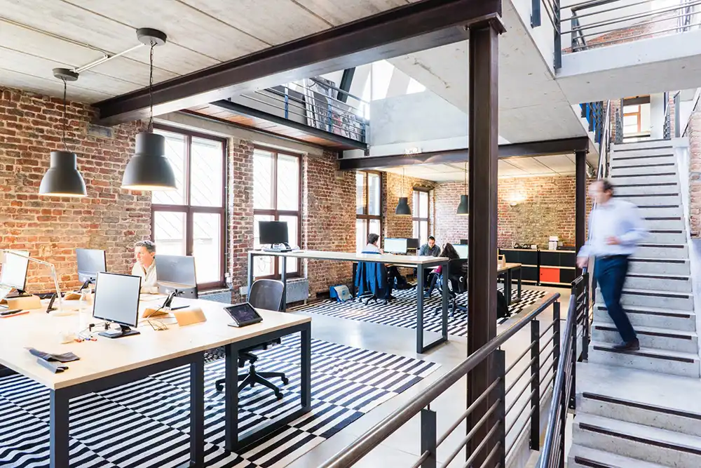 Workplace article man going down steps